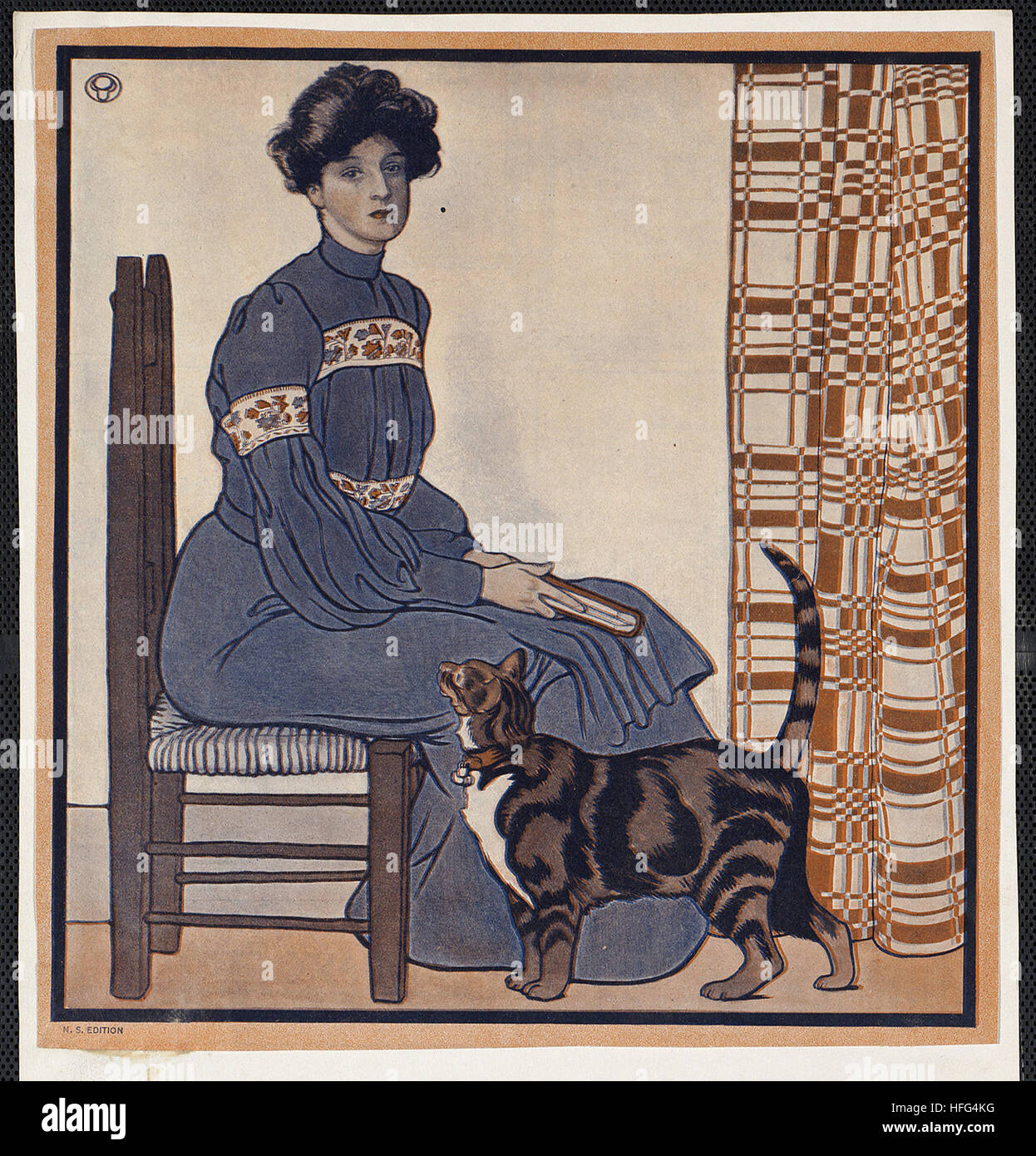 Woman sitting on a chair holding a book with a cat looking on Stock ...