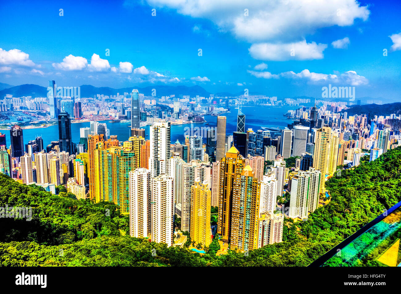 Hong Kong island peak lookout over Kowloon City centre Victoria Harbour sky scrapers apartments buildings vista view travel Stock Photo