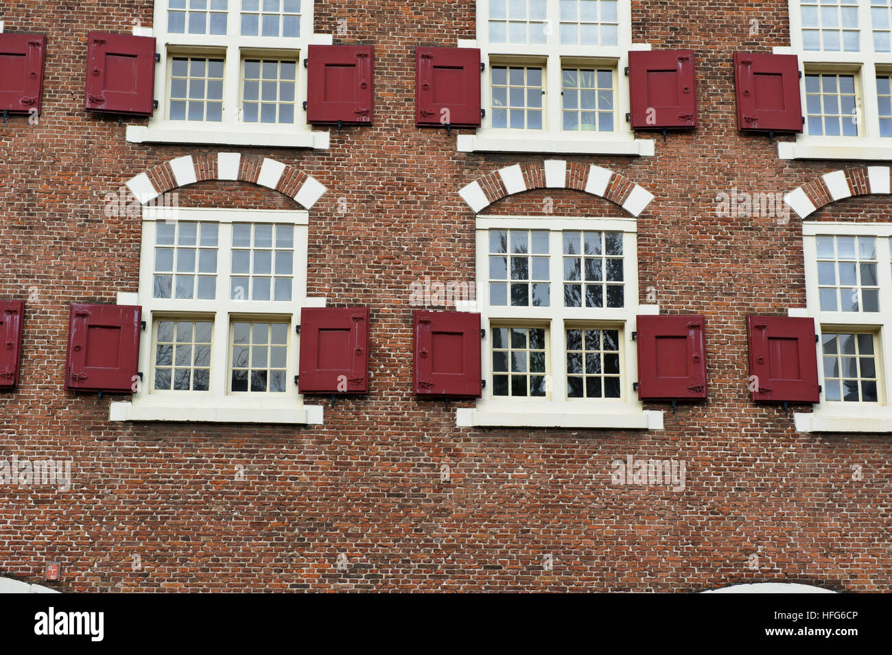 A traditional building with window wooden shutters in Amsterdam