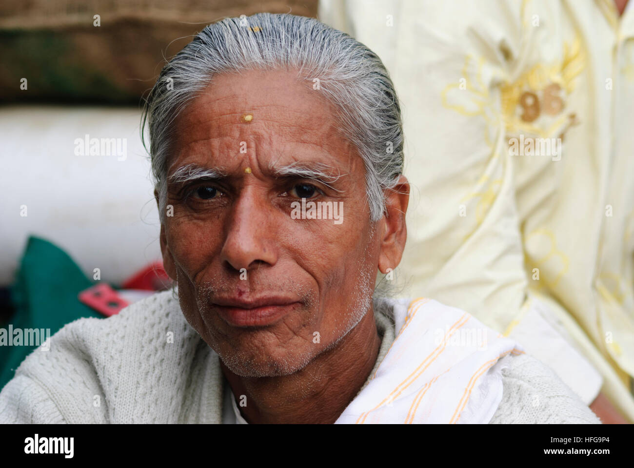 Portrait of a man with blue eyes in Guwahati, India.