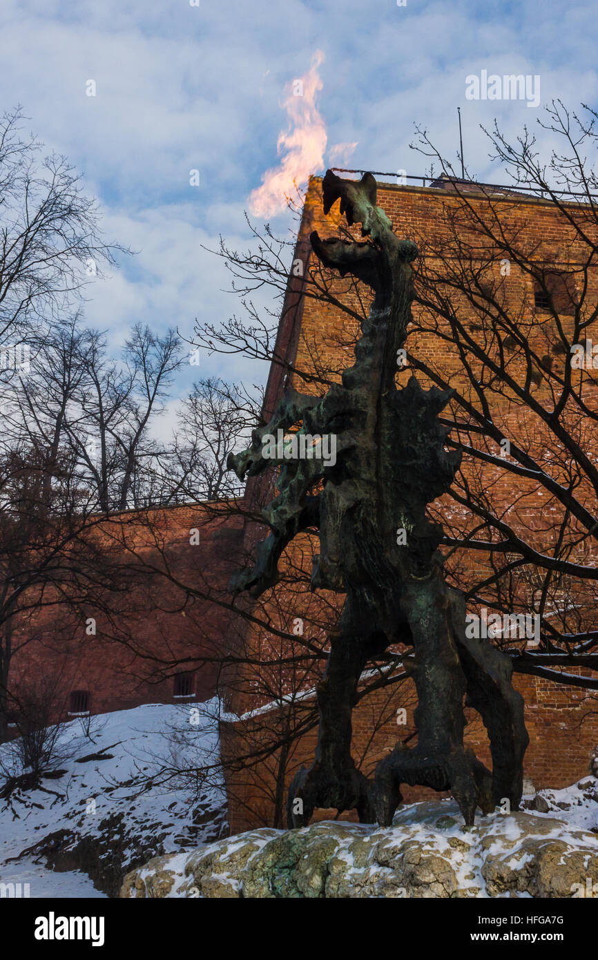 A fire-breathing dragon sculpture in front of Wawel Castle Hill, Krakow Stock Photo