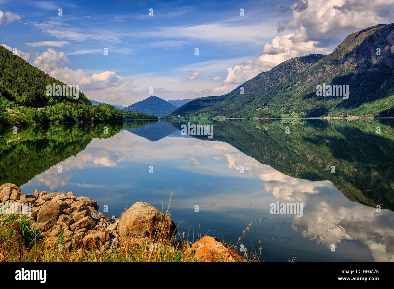 The almost perfect mirror reflections of a beautiful landscape in Norway Stock Photo