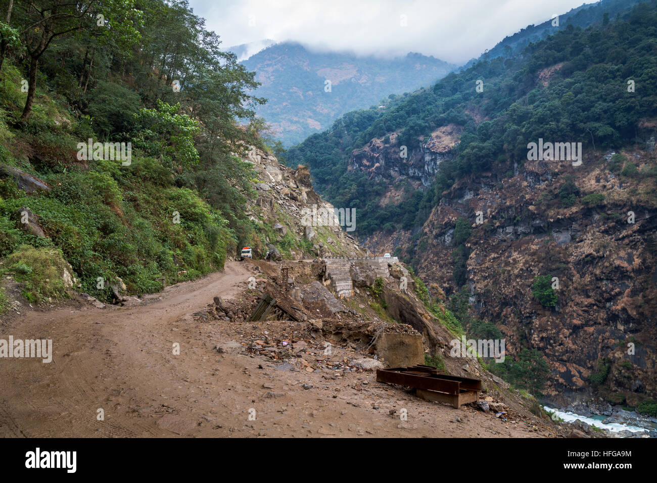 Dangerous mountain road in the Himalayan state of Sikkim, India prone to landslides. Stock Photo