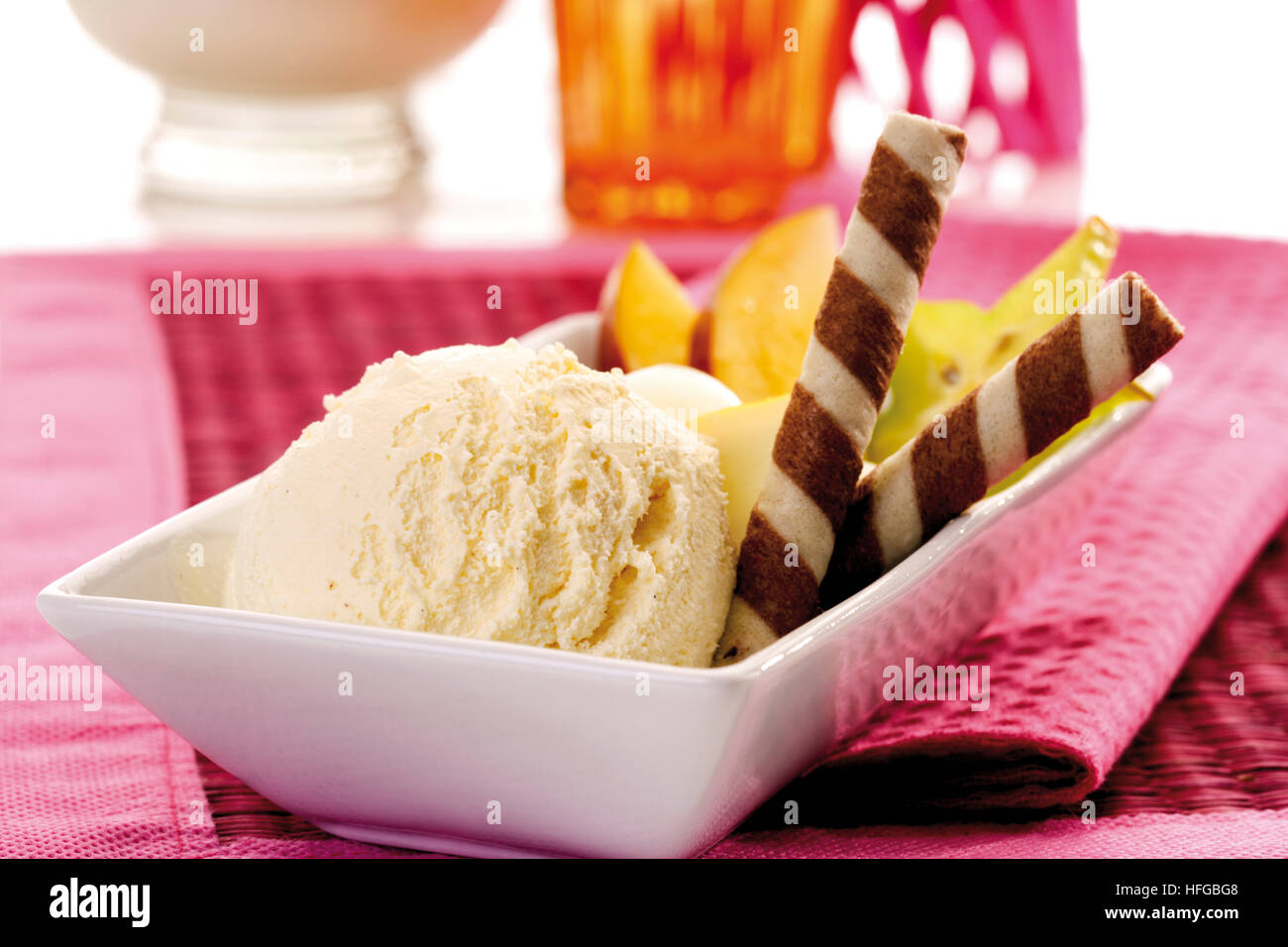 Bowl Of Vanilla Ice Cream Garnished With Rolled Wafers Stock Photo Alamy