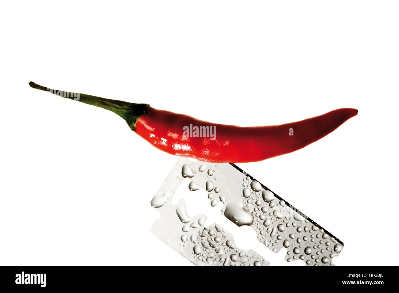 Hot pepper and razor blade Stock Photo Alamy