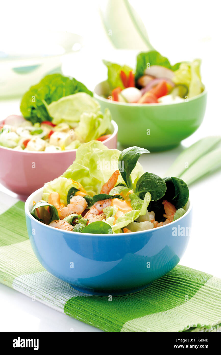 Shrimp salad in a bowl shrimps, lamb's lettuce, head lettuce and