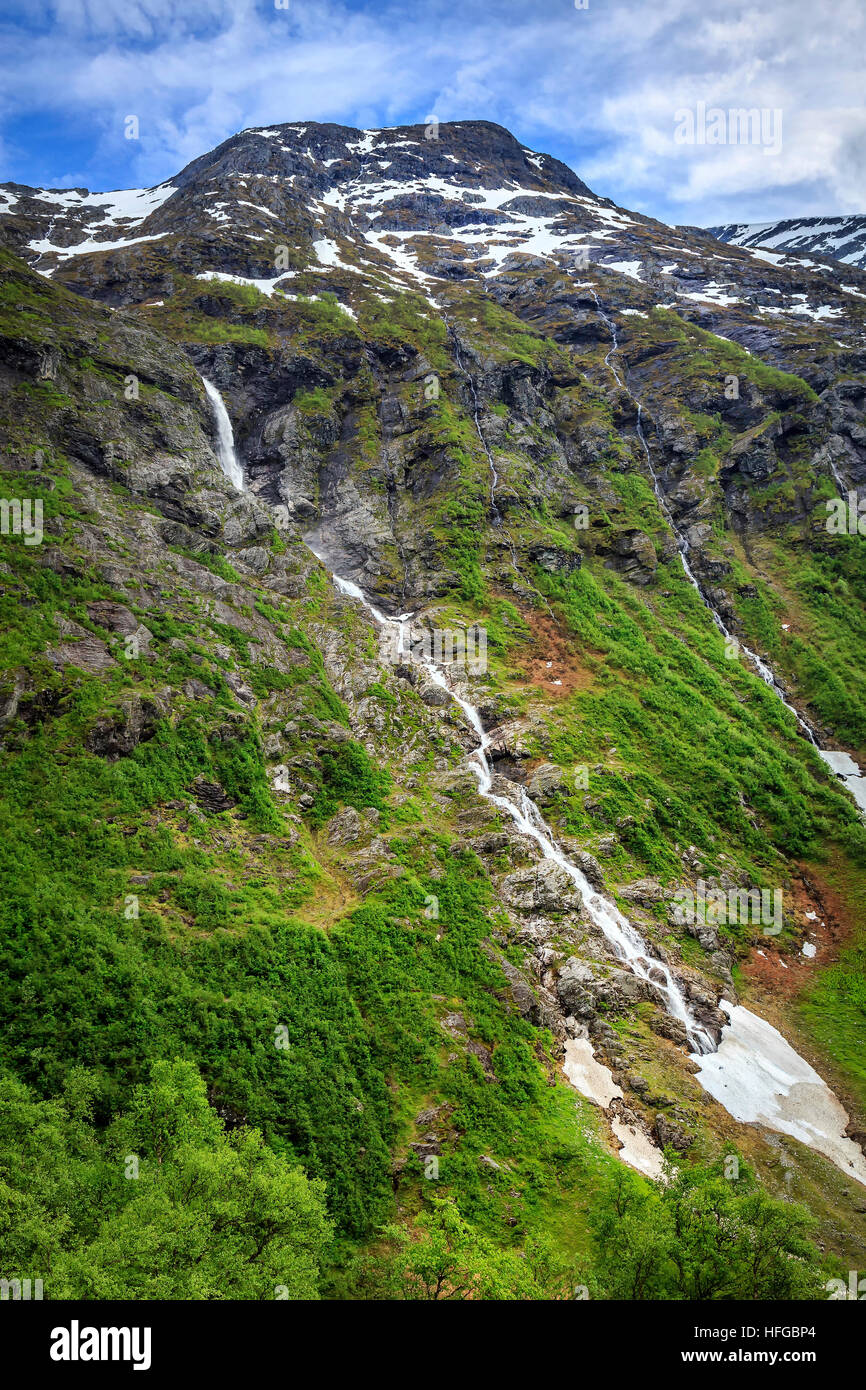 View across a valley of cascading waters from melting snow. Taken in Fjordane, Norway in Spring. Stock Photo