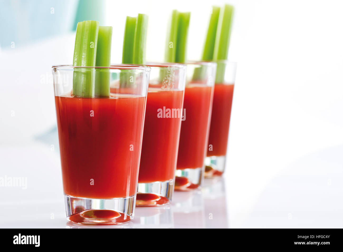 Bloody Marys garnished with celery Stock Photo Alamy