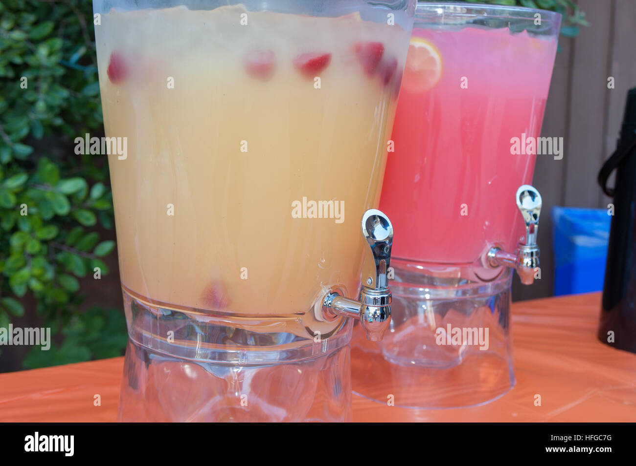 fruit punch in a drink dispenser at a party Stock Photo - Alamy