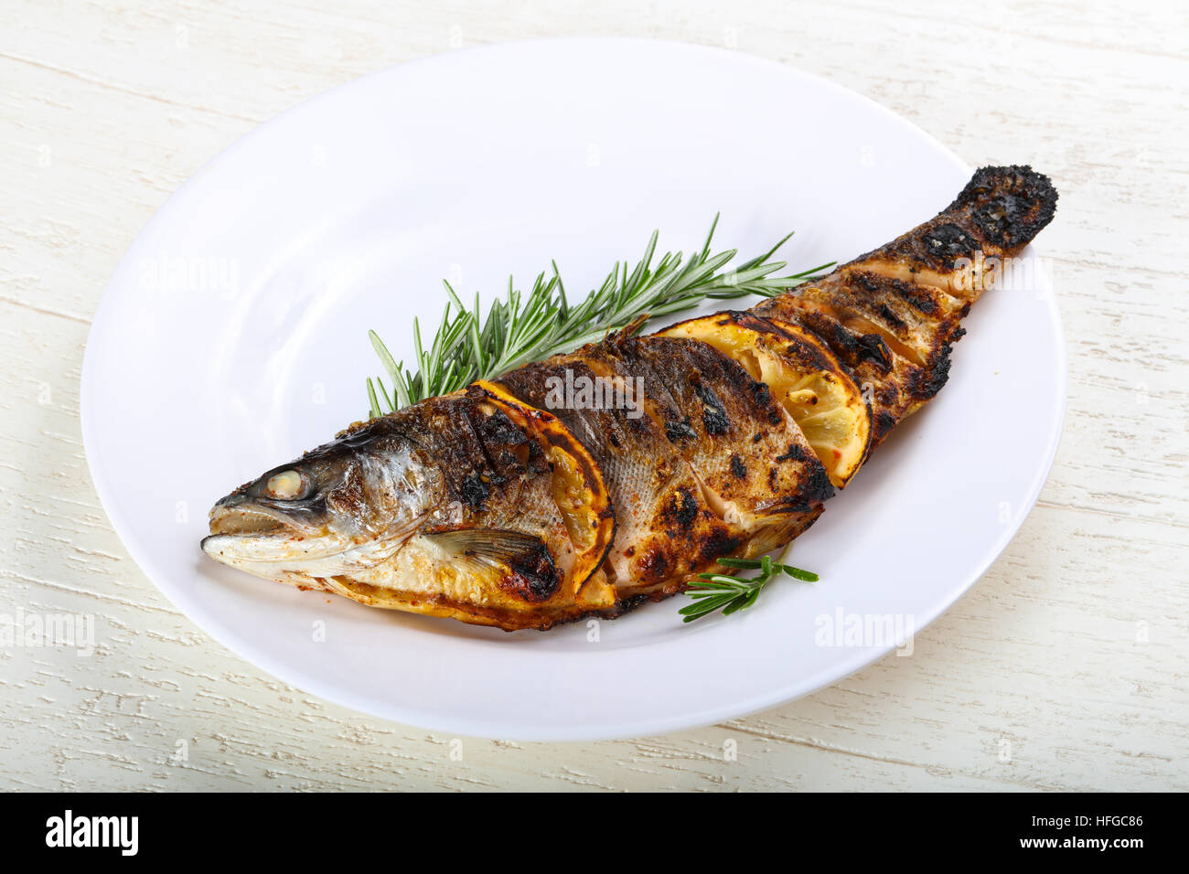 Hot fresh grilled trout with lemon and rosemary Stock Photo Alamy