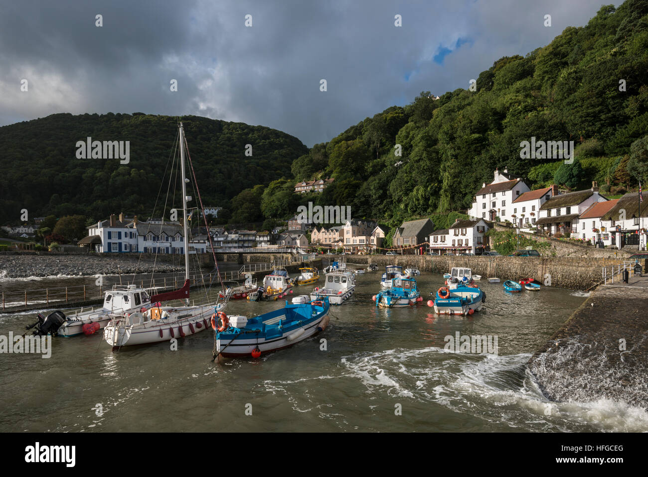 Lynmouth harbor, under moody skies, at high tide. Stock Photo