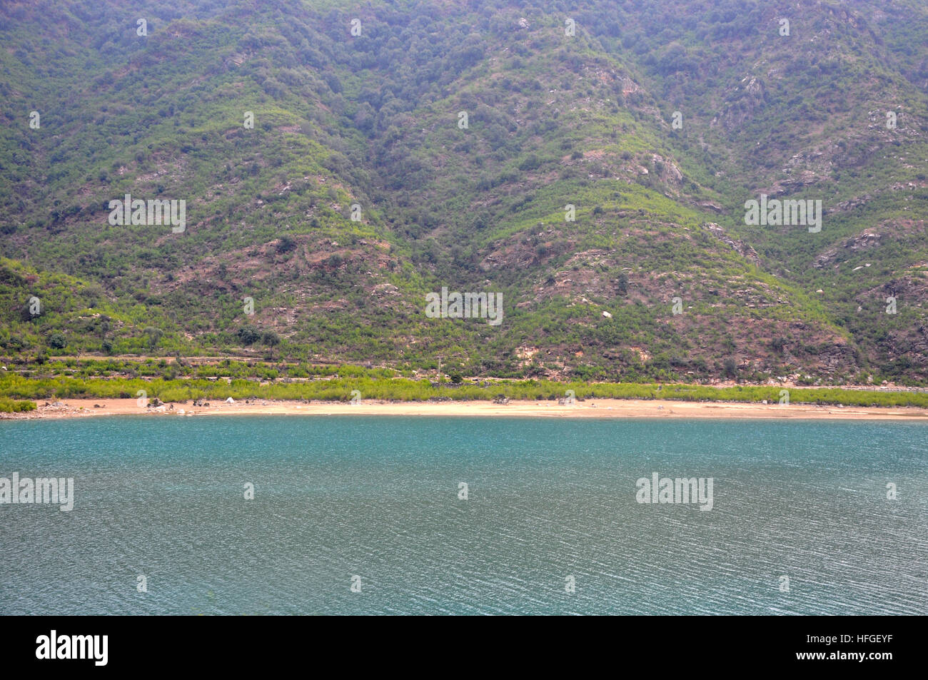 Coastal area along the mountain from up above Stock Photo