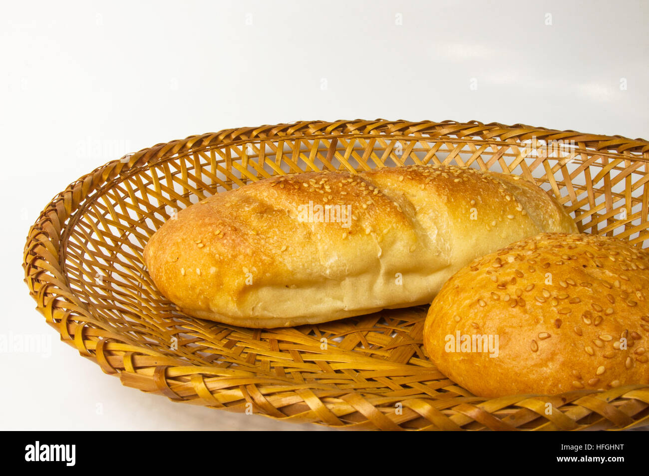 whole wheat bread and bun on a wicker plate Stock Photo - Alamy