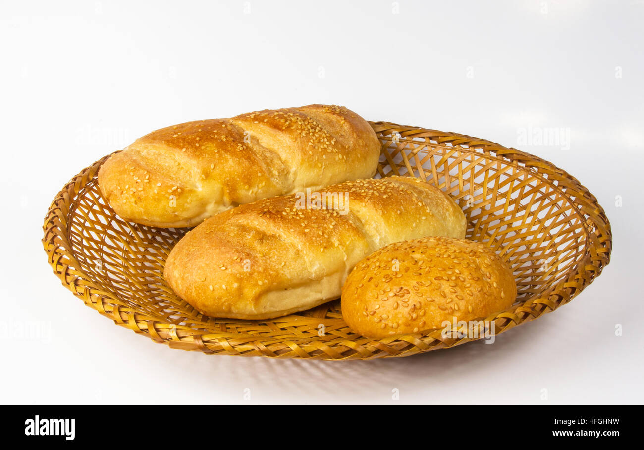 whole wheat breads and bun on a wicker plate Stock Photo - Alamy