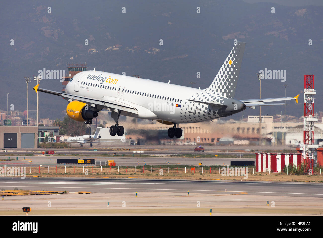 Vueling Airbus A320 landing at El Prat Airport in Barcelona, Spain