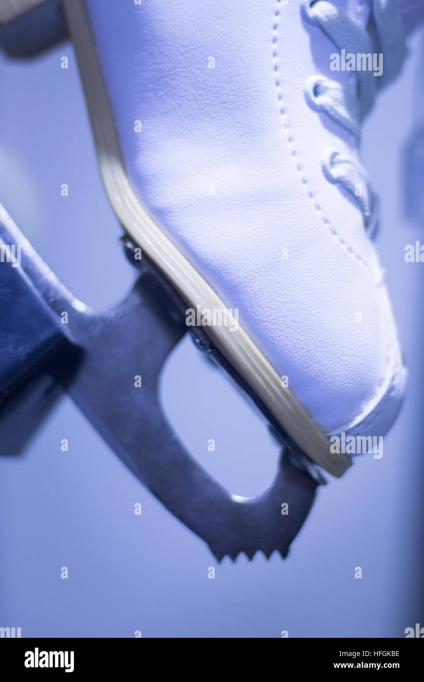 Ice skates in skate store shop window on display on sale for skating on