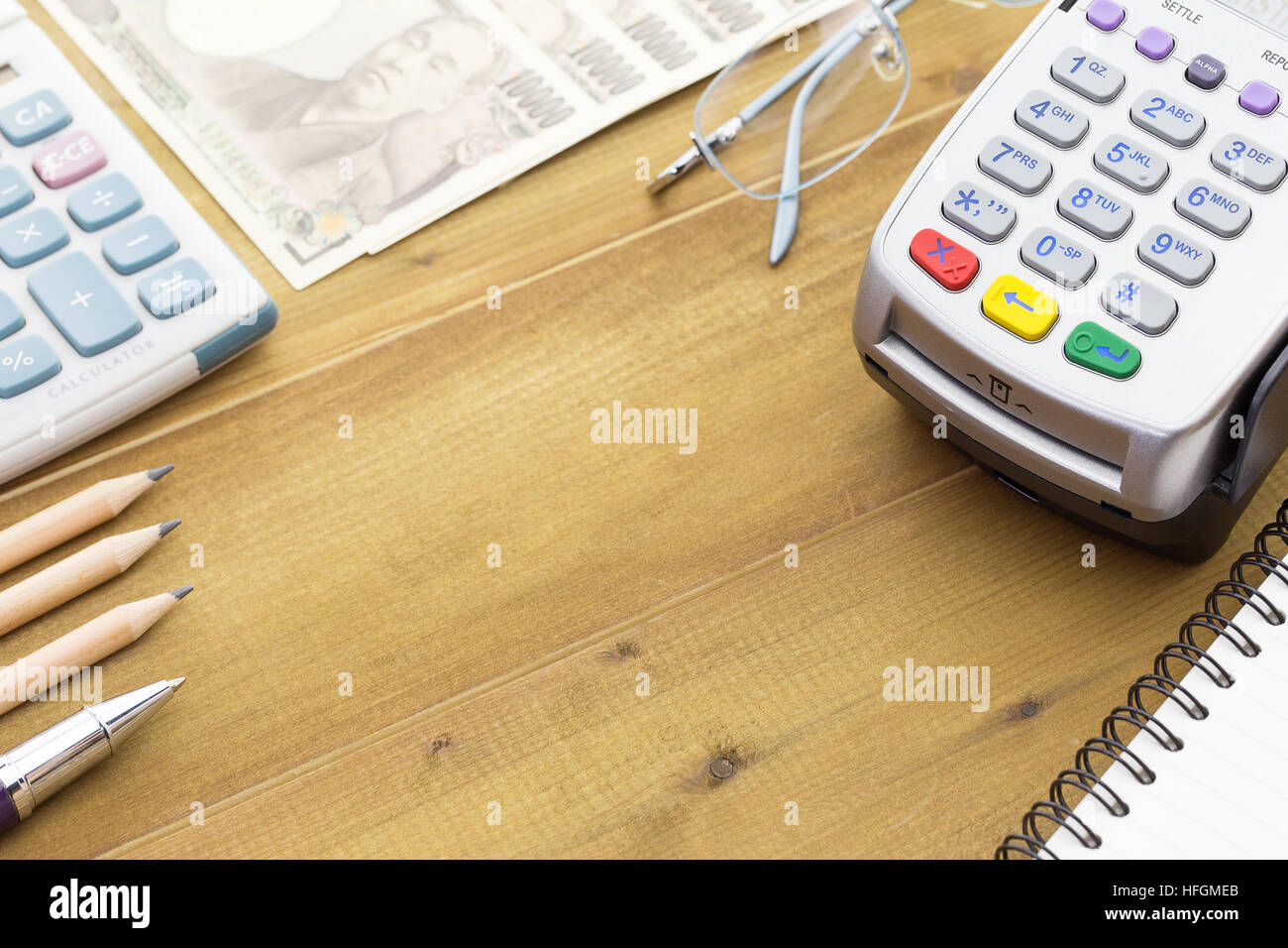 Credit Card Terminal or EDC on cashier wooden table in the store with