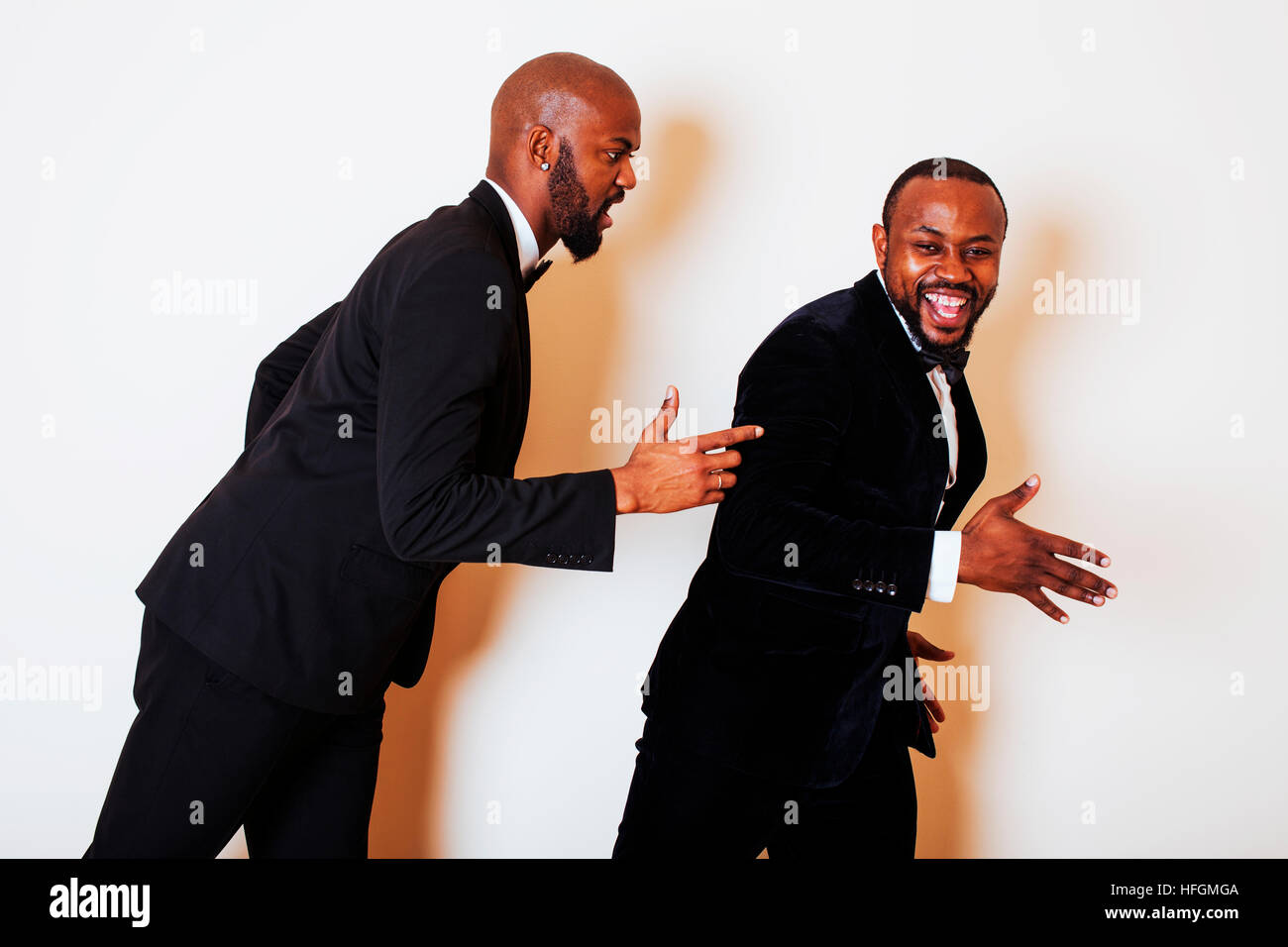 two afro-american businessmen in black suits emotional posing, g Stock ...