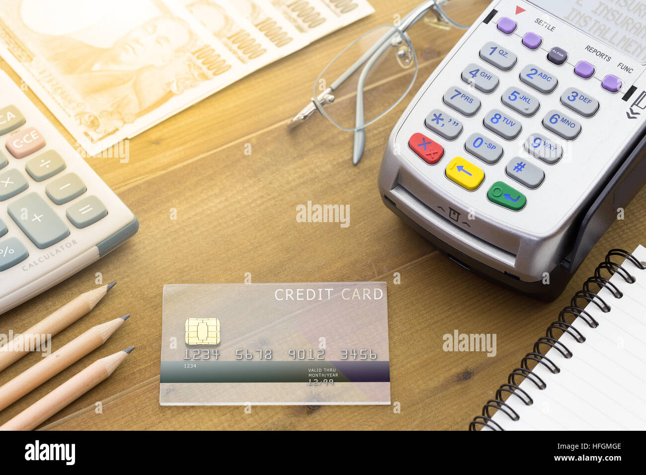 Cashier hand holding a Credit card over EDC machine or credit card