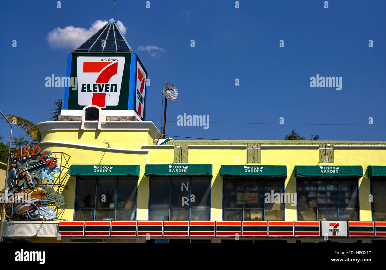 7-eleven convenience store against a deep blue summer sky. Thailand S. E. Asia. Asian 7- 11 Stock Photo
