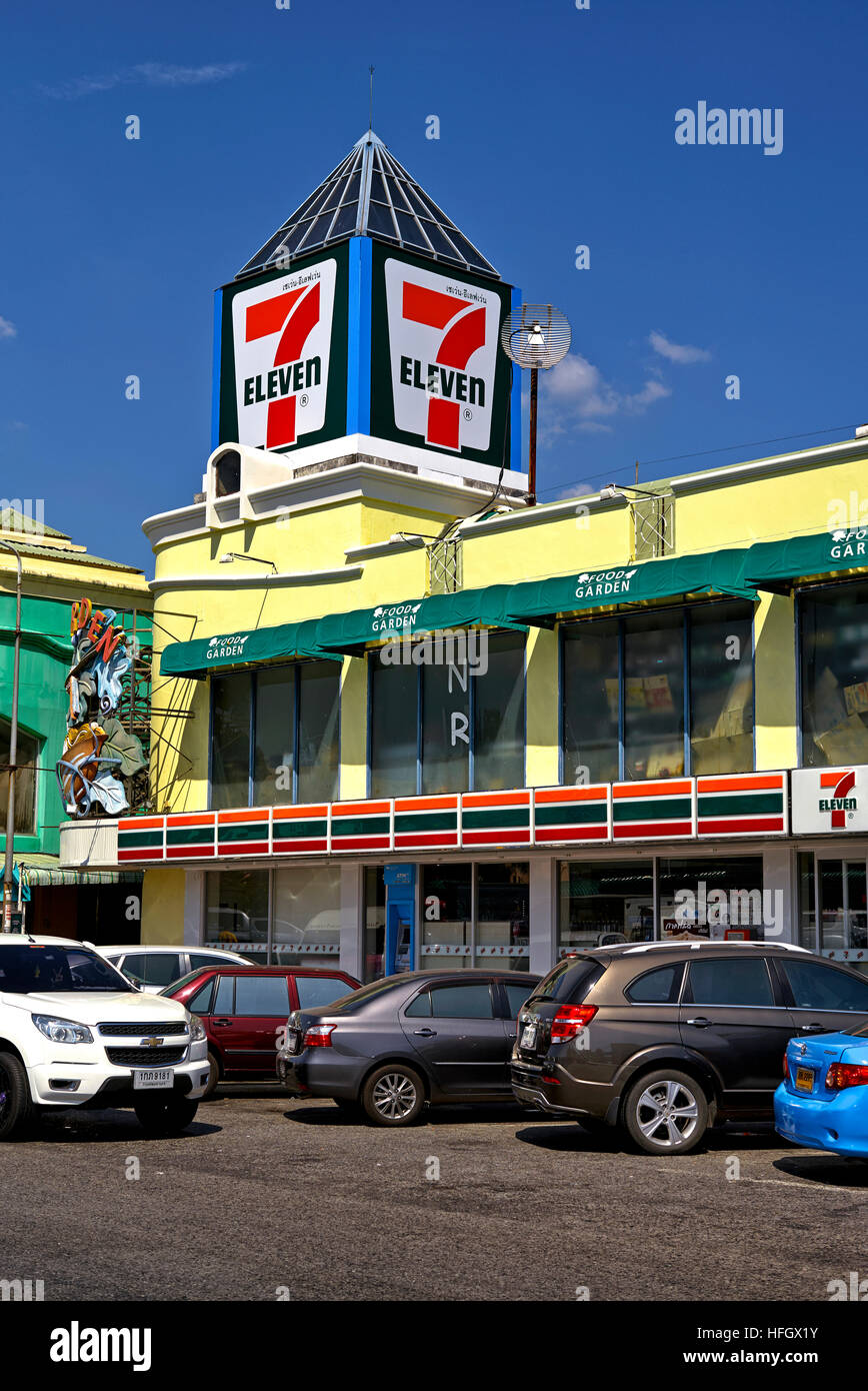 7-eleven convenience store against a deep blue summer sky. Thailand S. E. Asia. Asian 7- 11 Stock Photo