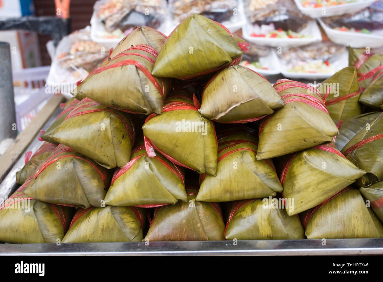 Steamed snack Pork and sticky rice wrapped in banana leaves Stock