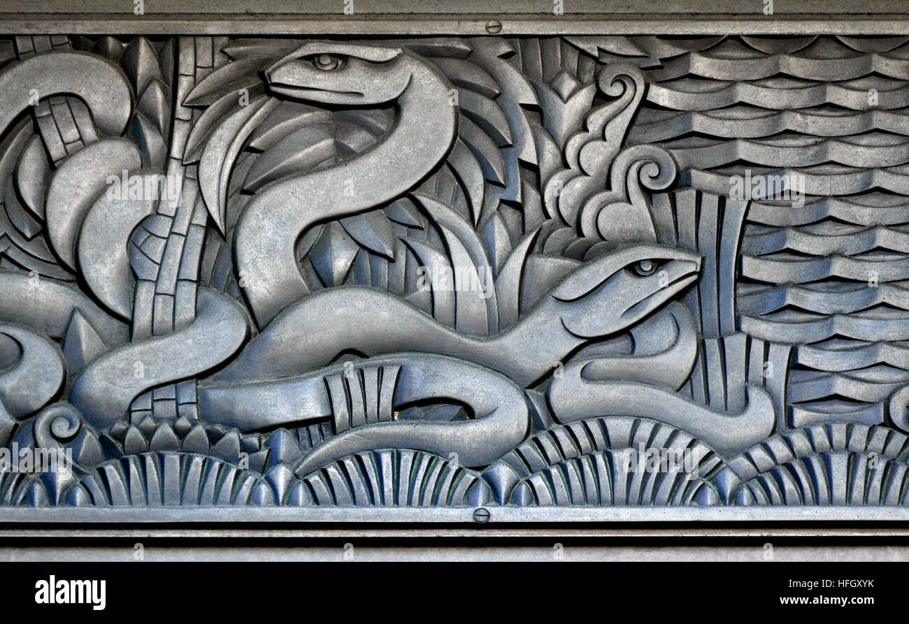 London, England, UK. Former Derry and Toms Dept Store, Kensington High Street (Art Deco, 1933 - arch: Bernard George) Art Deco facade detail - snakes Stock Photo