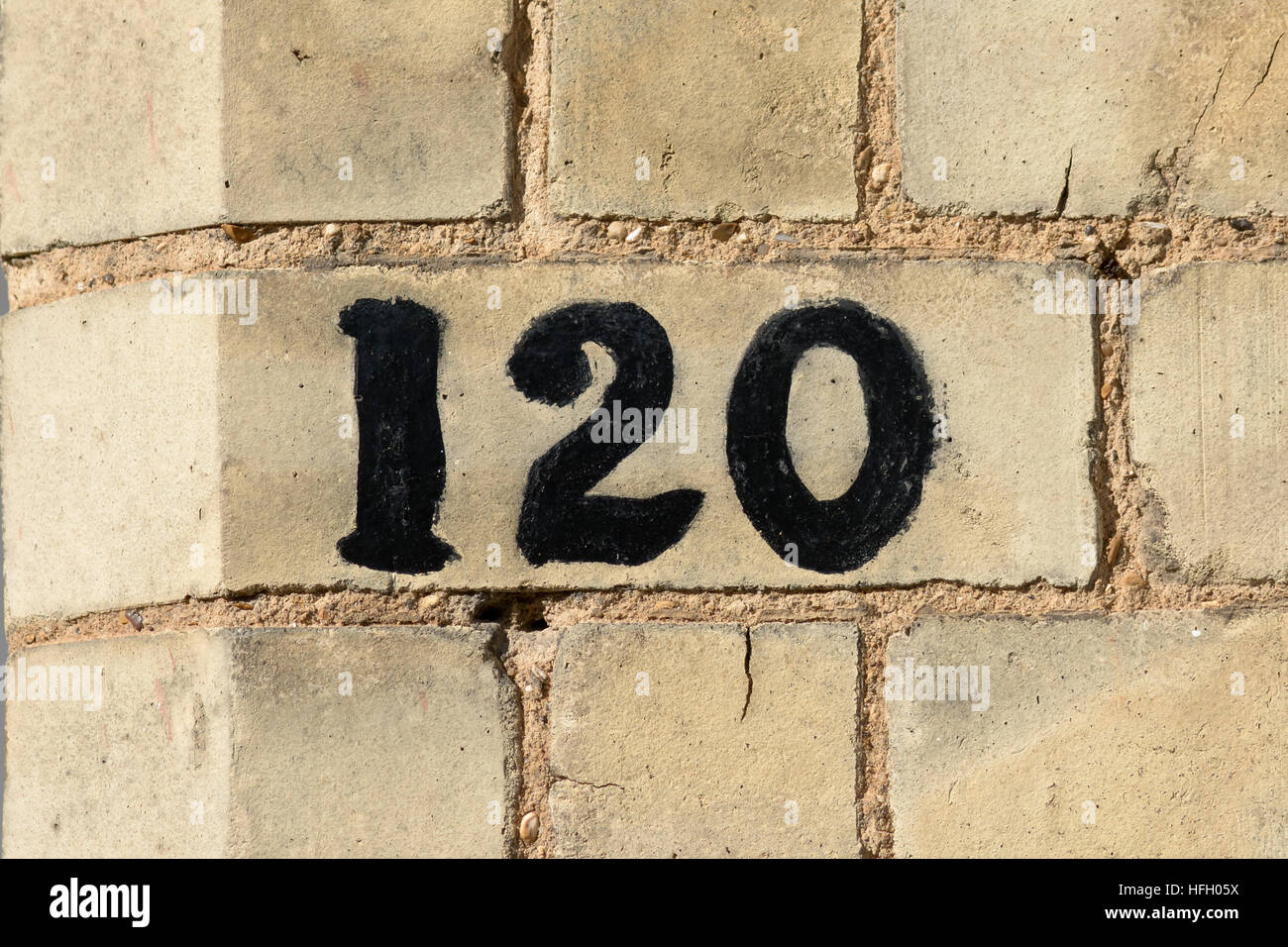 House Number 120 painted sign on wall Stock Photo - Alamy