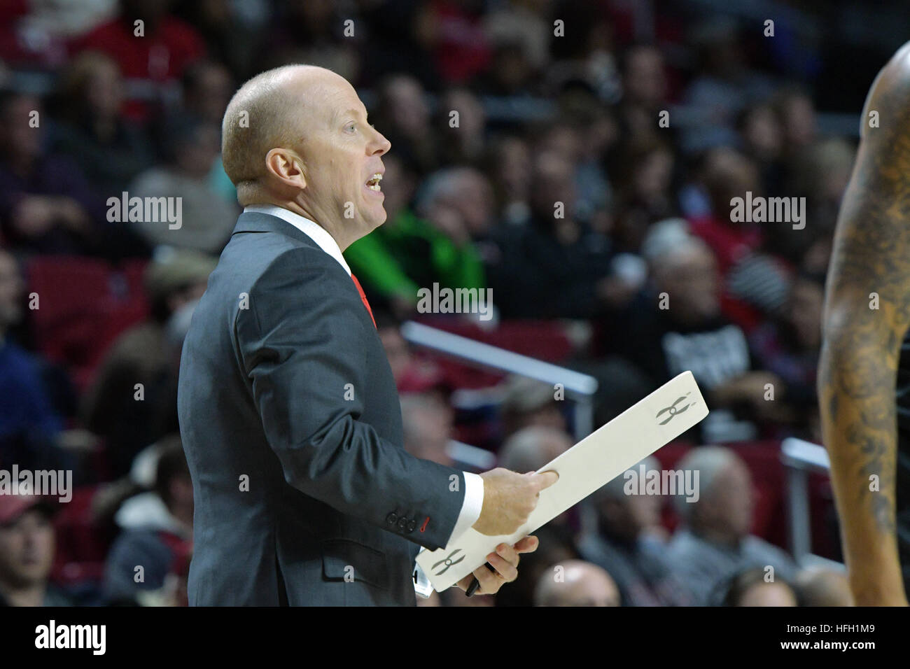Philadelphia, Pennsylvania, USA. 28th Dec, 2016. Cincinnati Bearcats head coach MICK CRONIN gestures towards the court holding a clipboard during the American Athletic Conference basketball game being played at the Liacouras Center in Philadelphia. The Bearcats beat the Owls 56-50 in the AAC opener for both teams. © Ken Inness/ZUMA Wire/Alamy Live News Stock Photo