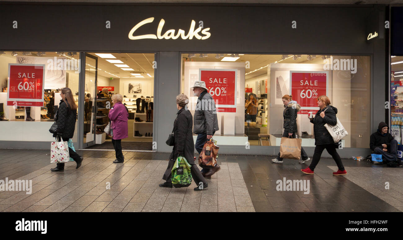 Clarks shoe shops. Southport, Merseyside, Shoppers passing Clarks shoe  store, shop front with Summer Sales signs 60% off Posters Stock Photo -  Alamy