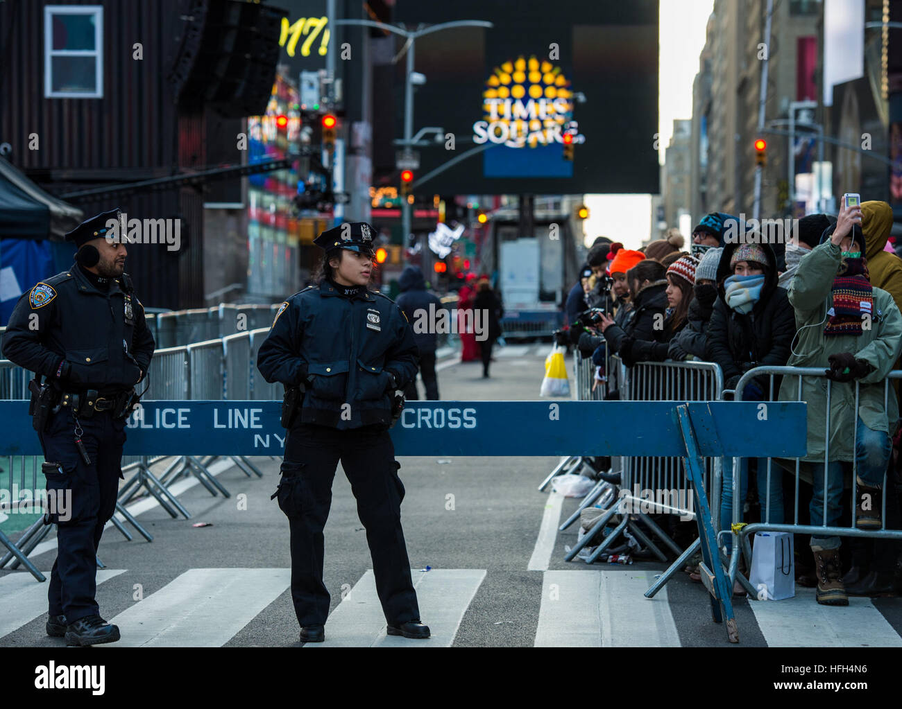 New York, USA. 31st Dec, 2016. Police officers stand guard at Times ...