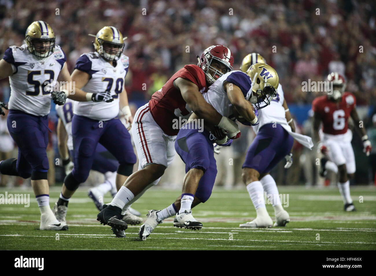 Atlanta, Florida, USA. 31st Dec, 2016. MONICA HERNDON | Times.Alabama Crimson Tide defensive lineman Jonathan Allen (93) stops Washington Huskies running back Myles Gaskin (9) for a loss of 3 yards during the second quarter of the Chick Fil A Peach Bowl at the Georgia Dome in downtown Atlanta on Saturday December 31, 2016. © Monica Herndon/Tampa Bay Times/ZUMA Wire/Alamy Live News Stock Photo