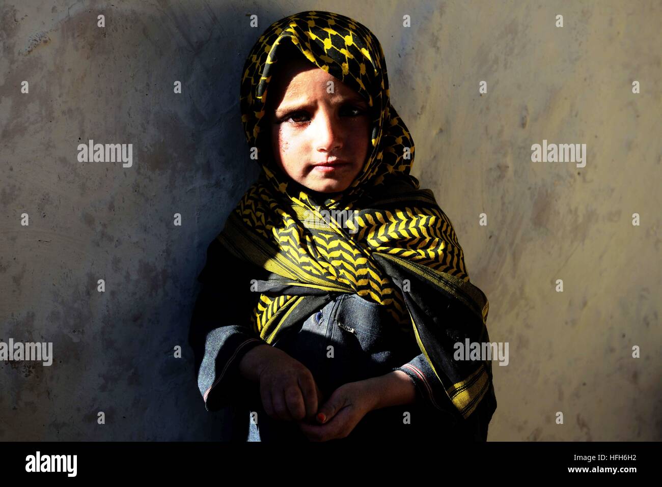 Beijing, Afghanistan's Zabul province. 26th Dec, 2016. An Afghan displaced child stands outside her tent in Qalat city, capital of southern Afghanistan's Zabul province, Dec. 26, 2016. More than one million people have to flee their home due to conflicts in the country, according to officials. © Sanaullah Seiam/Xinhua/Alamy Live News Stock Photo