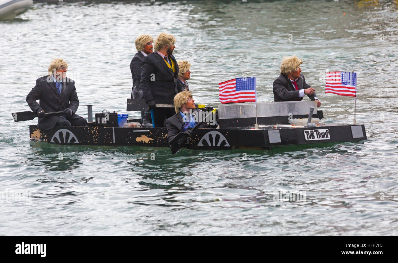 Poole, Dorset, UK. 1st Jan, 2017. Hundreds turn out to watch the New Years Day Bath Tub Race. A variety of unusual craft take to the water to race, having fun throwing eggs and flour, firing water cannons and capsizing competing craft. Trumps with wigs hair and make up in Tub Trump © Carolyn Jenkins/Alamy Live News Stock Photo