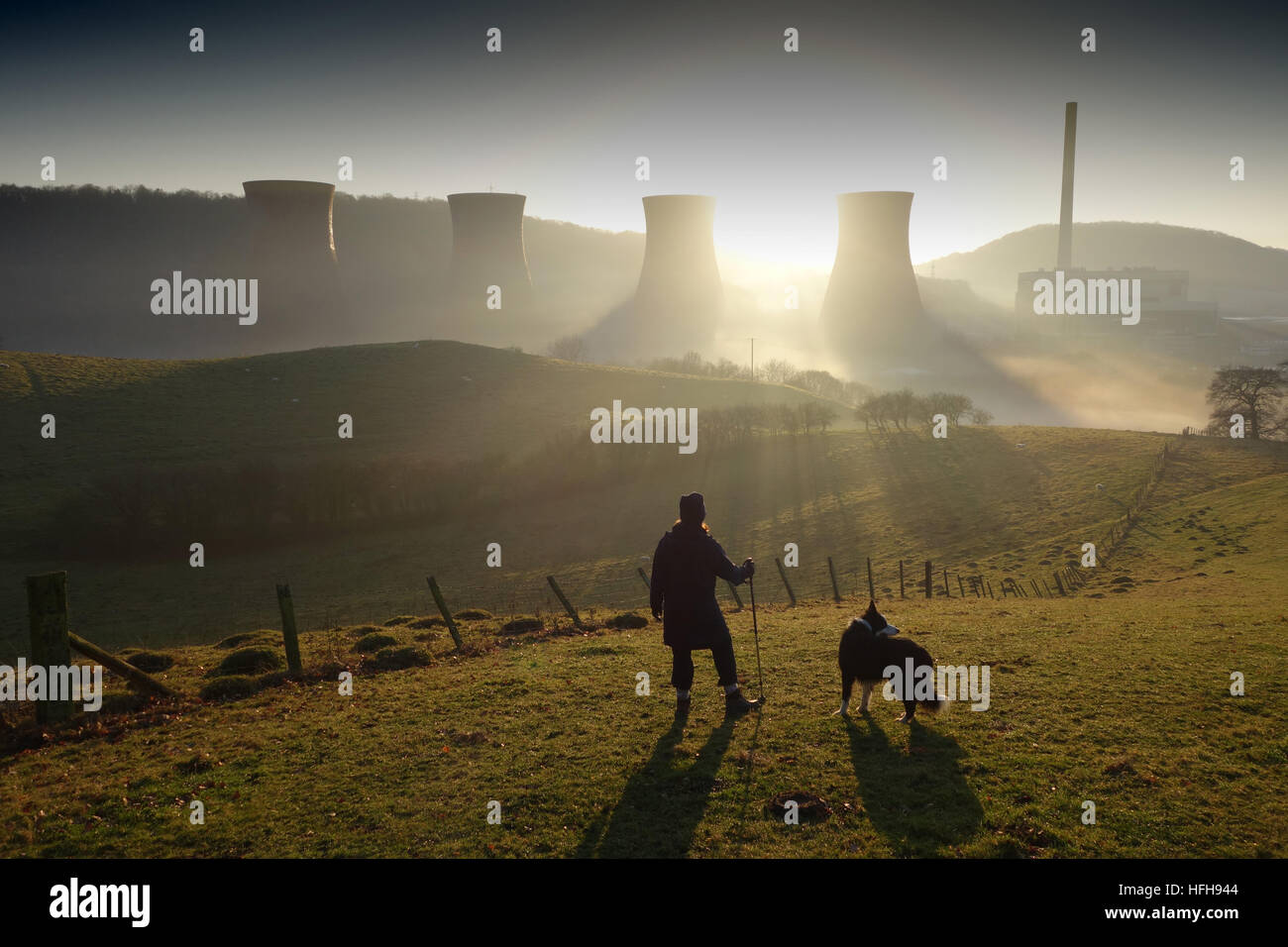 After a rainy New Years Day the sun finally appears between the cooling towers of Ironbridge Power Station in the late afternoon. Credit: David Bagnall/Alamy Live News Stock Photo