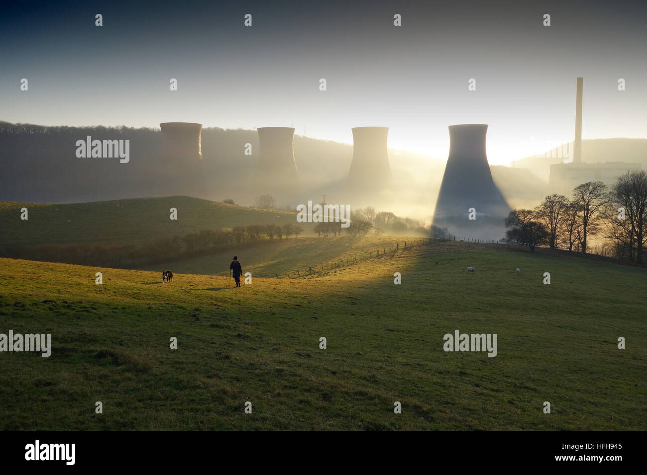 After a rainy New Years Day the sun finally appears between the cooling towers of Ironbridge Power Station in the late afternoon. Credit: David Bagnall/Alamy Live News Stock Photo