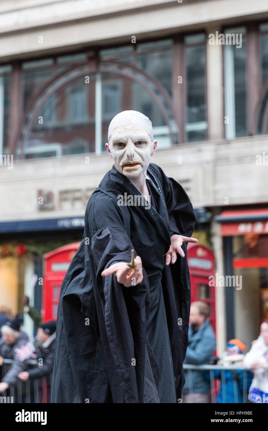 Westminster, London, 1st January 2017. A participant from the Lights Camera Action movie character theme on stilts along the parade. The London New Year's Day Parade, LNYDP 2017, has been a turn-of-year tradition since 1987 and features several thousand performers from all around the world. Credit: Imageplotter News and Sports/Alamy Live News Stock Photo