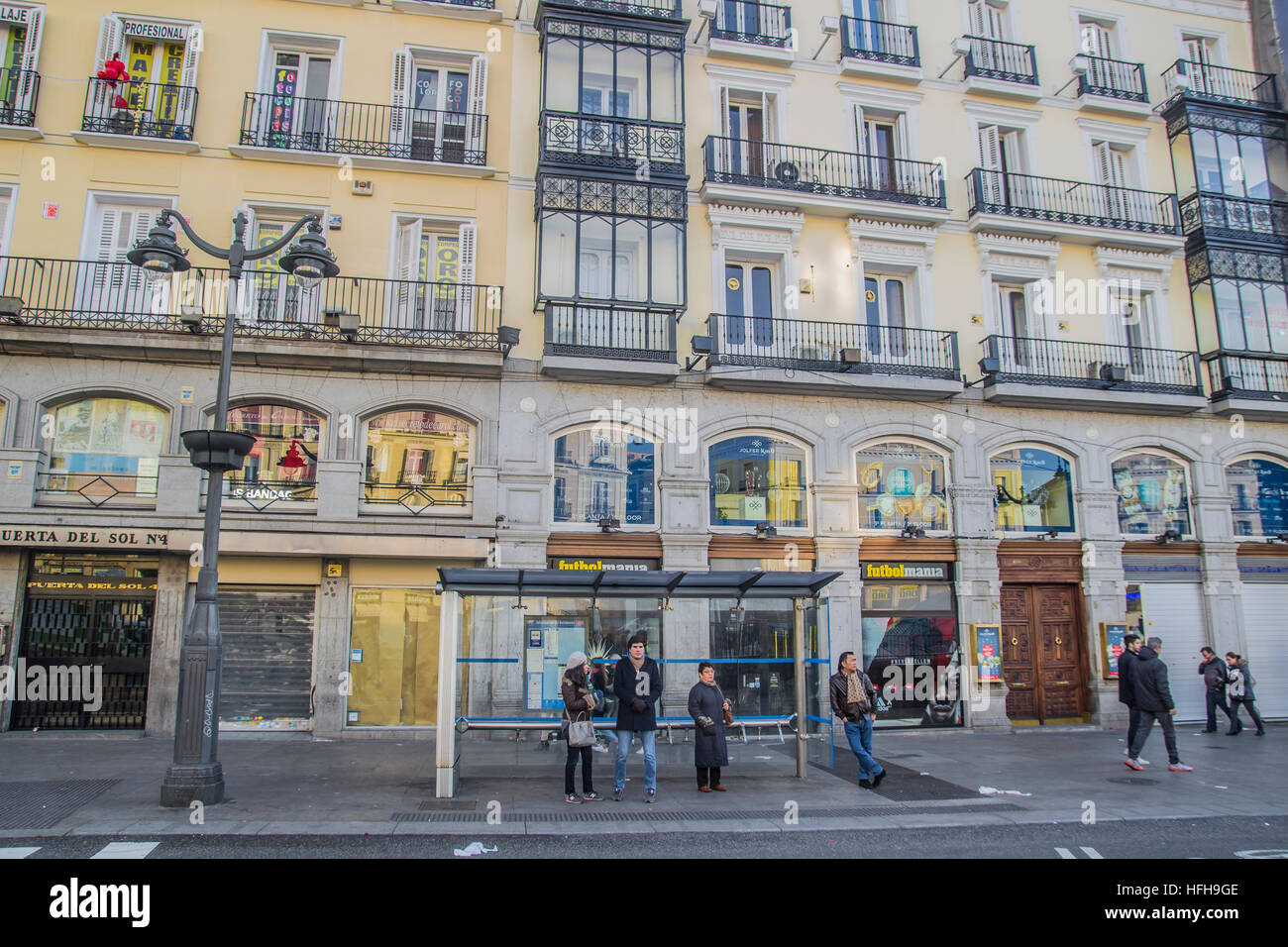 Madrid, Spain. 1st January 2017. Madrid, January 1th 2017. First day of 2017 on the streets in Madrid, Spain. In the picture few people in square puerta del sol waiting for a bus. Credit: Alberto Sibaja Ramírez/Alamy Live News Stock Photo