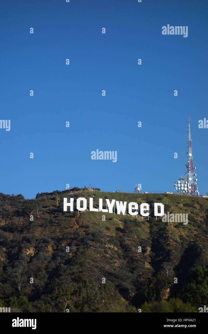 Hollywood, USA. 1st January 2017. The iconic Hollywood Sign was altered by pranksters to read 'Hollyweed'.  Residents nearby the sign awoke to this view on New Year's Day. The iconic sign was similarly altered once before on Jan. 1, 1976. Credit: Robert Landau/Alamy Live News Stock Photo