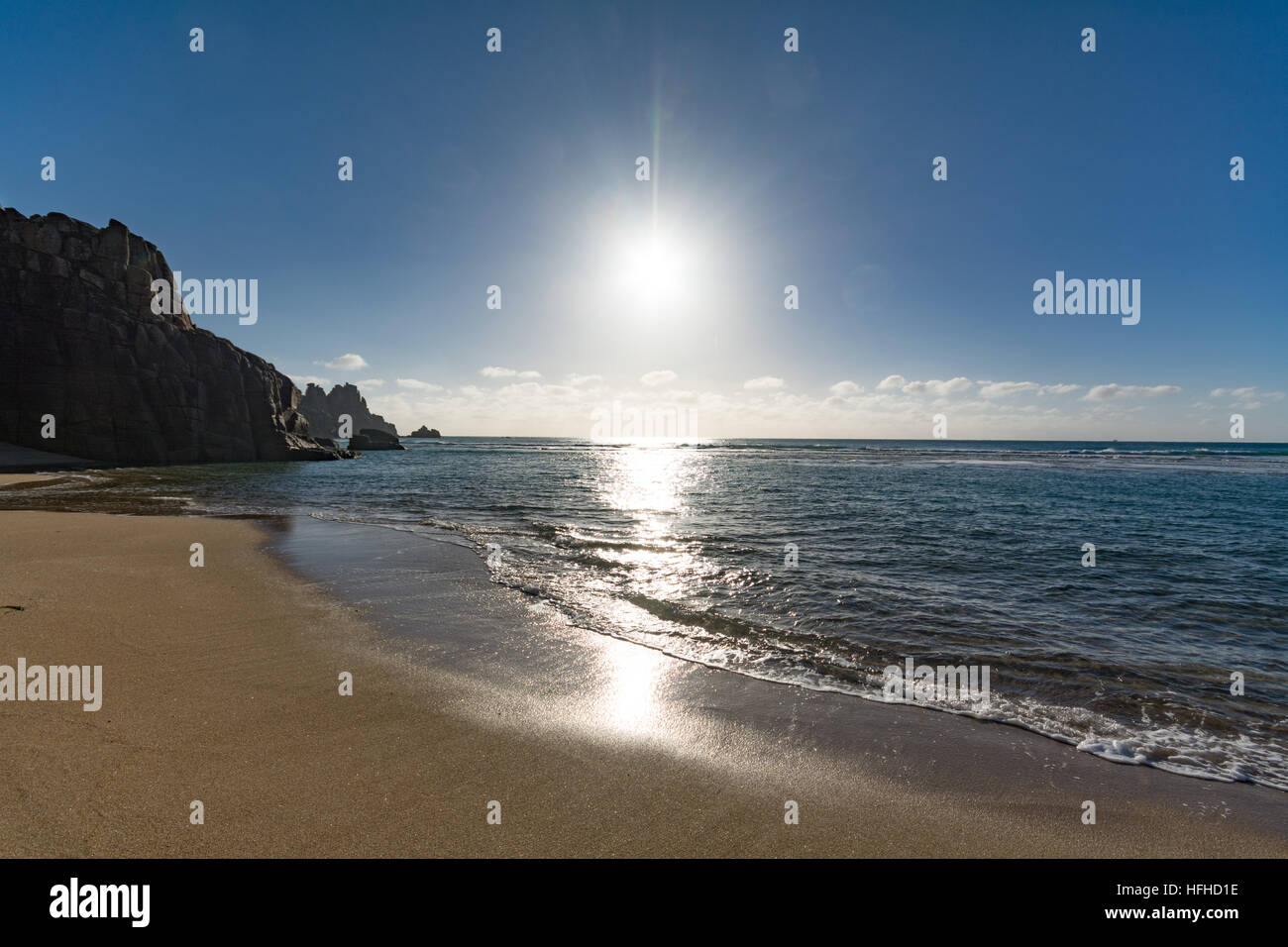 Treen, Cornwall, UK. 2nd Jan, 2017. UK Weather. Sheletered from the cold northerly winds it was hot and sunny enough for people to be sunbathing and swimming in the sea today at Treen, near Porthcurno. © cwallpix/Alamy Live News Stock Photo