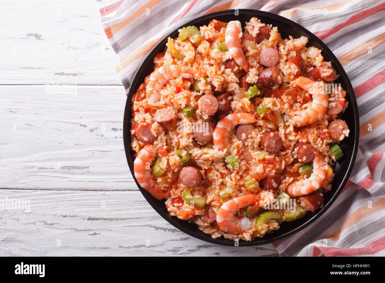 Delicious Creole jambalaya with shrimp and sausage on a plate. Horizontal top view Stock Photo