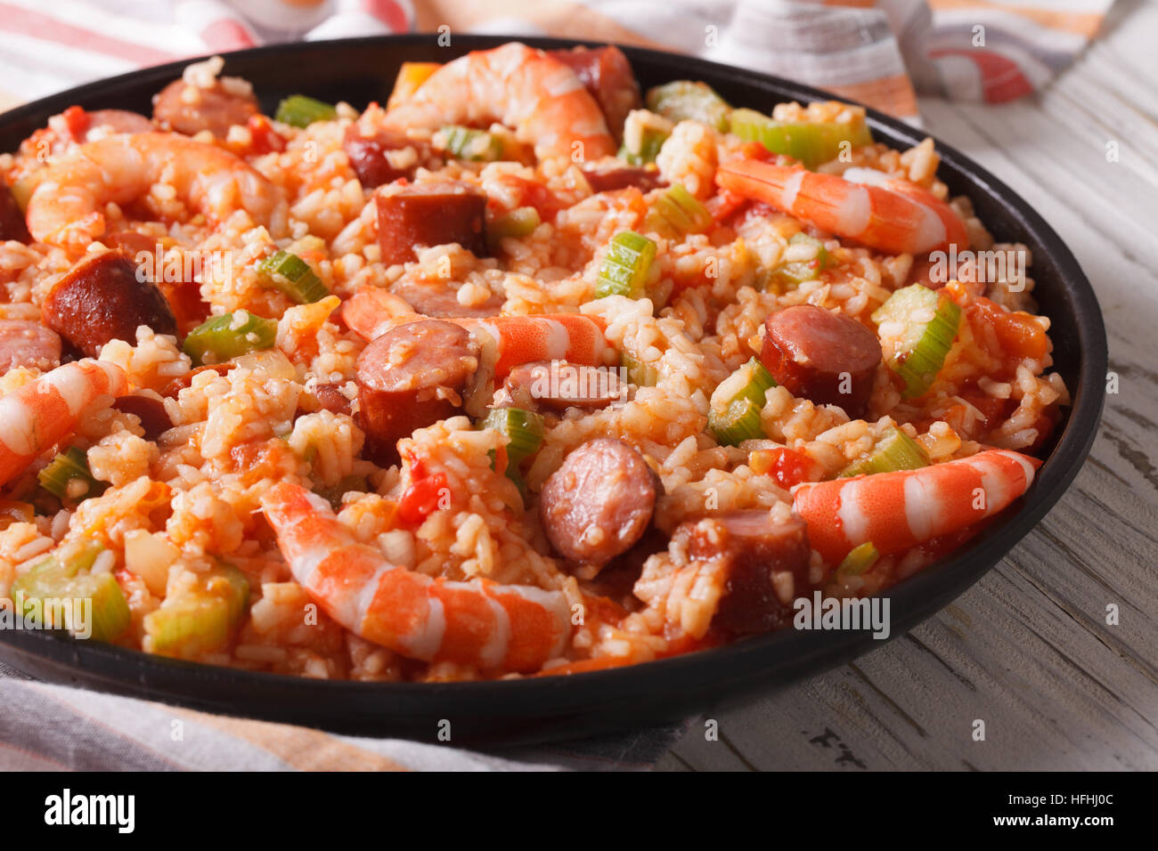 Creole food jambalaya closeup on a plate on the table. horizontal