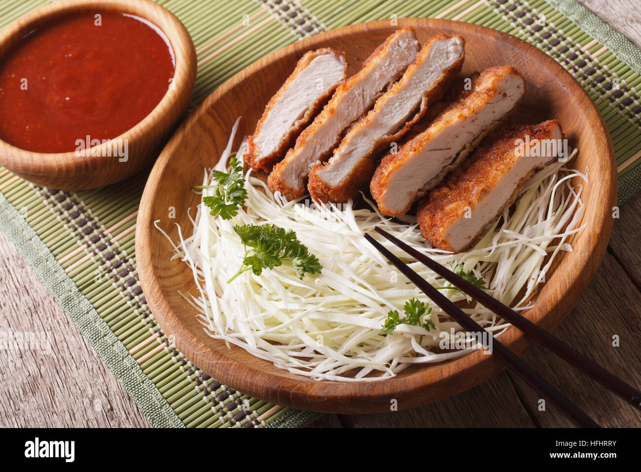 Tonkatsu Japanese breaded deep fried pork cutlet serve with slice cabbage closeup horizontal