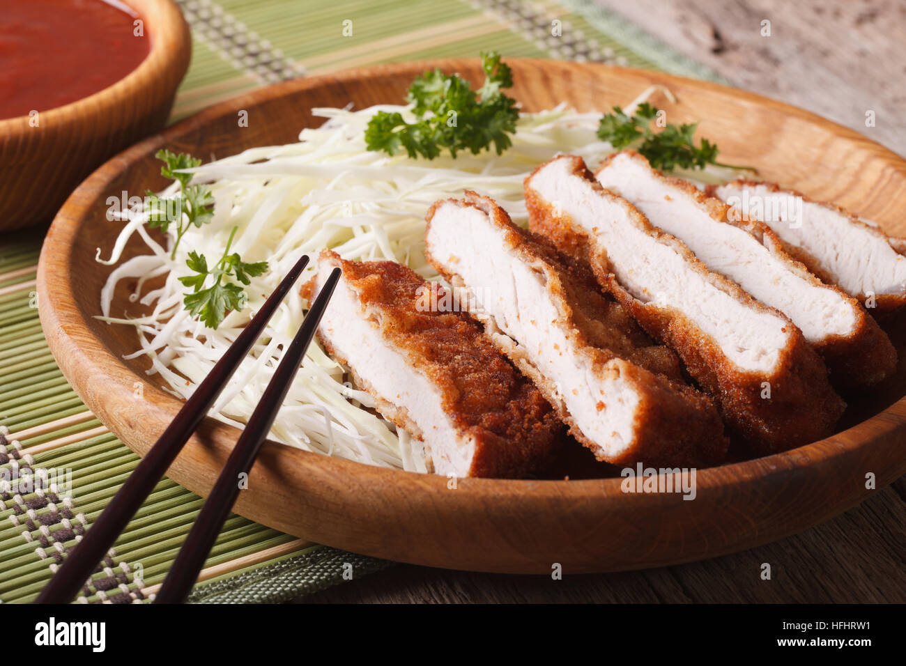 Japanese food: breaded deep fried pork tonkatsu with cabbage and sauce ...