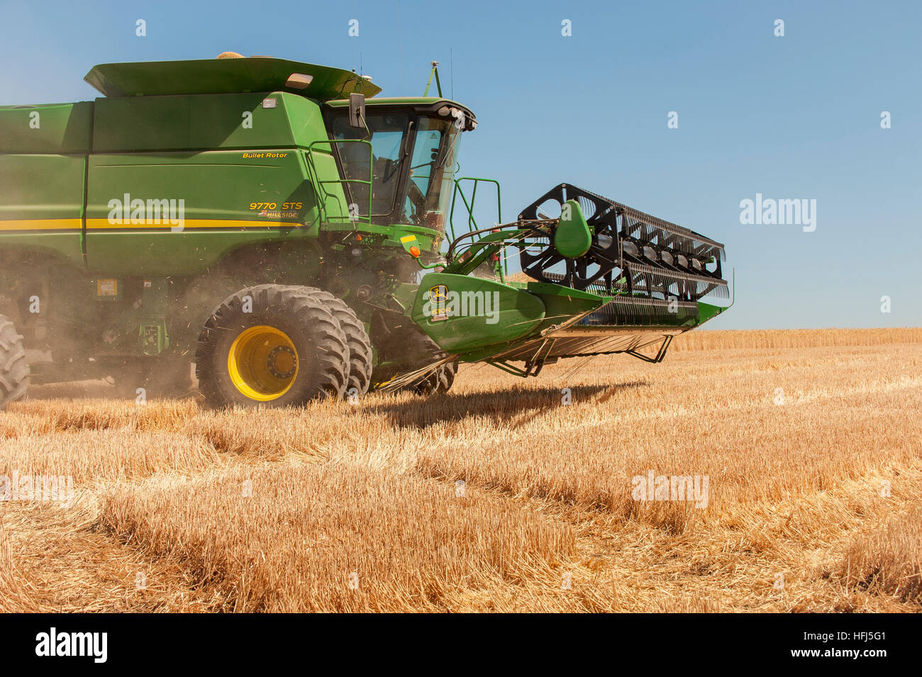 Crop harvesting with modern farm equipment Stock Photo Alamy