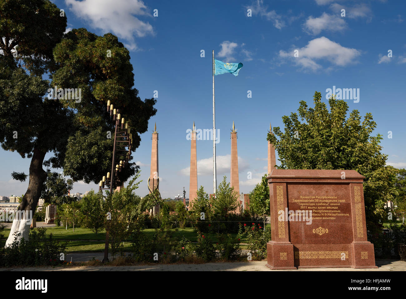 Granite memorial plaque and columns with Kazakh flag in Independence Park Shymkent Kazakhstan Stock Photo