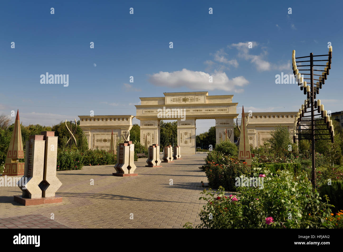 Gates to Independence Park Shymkent Kazakhstan with moon and rose flower gardens Stock Photo