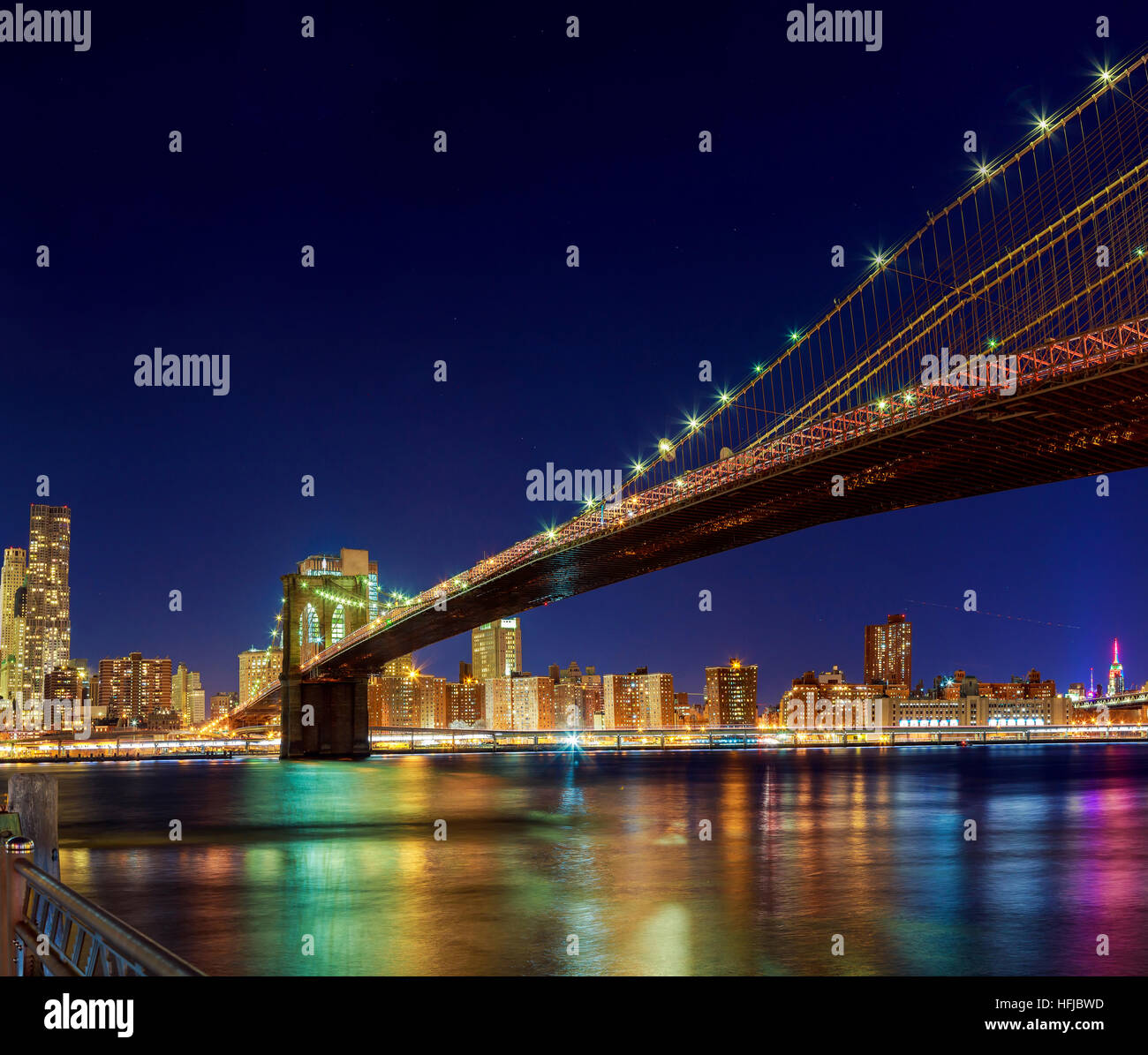 Brooklyn Bridge over East River at night in New York City Manhattan ...