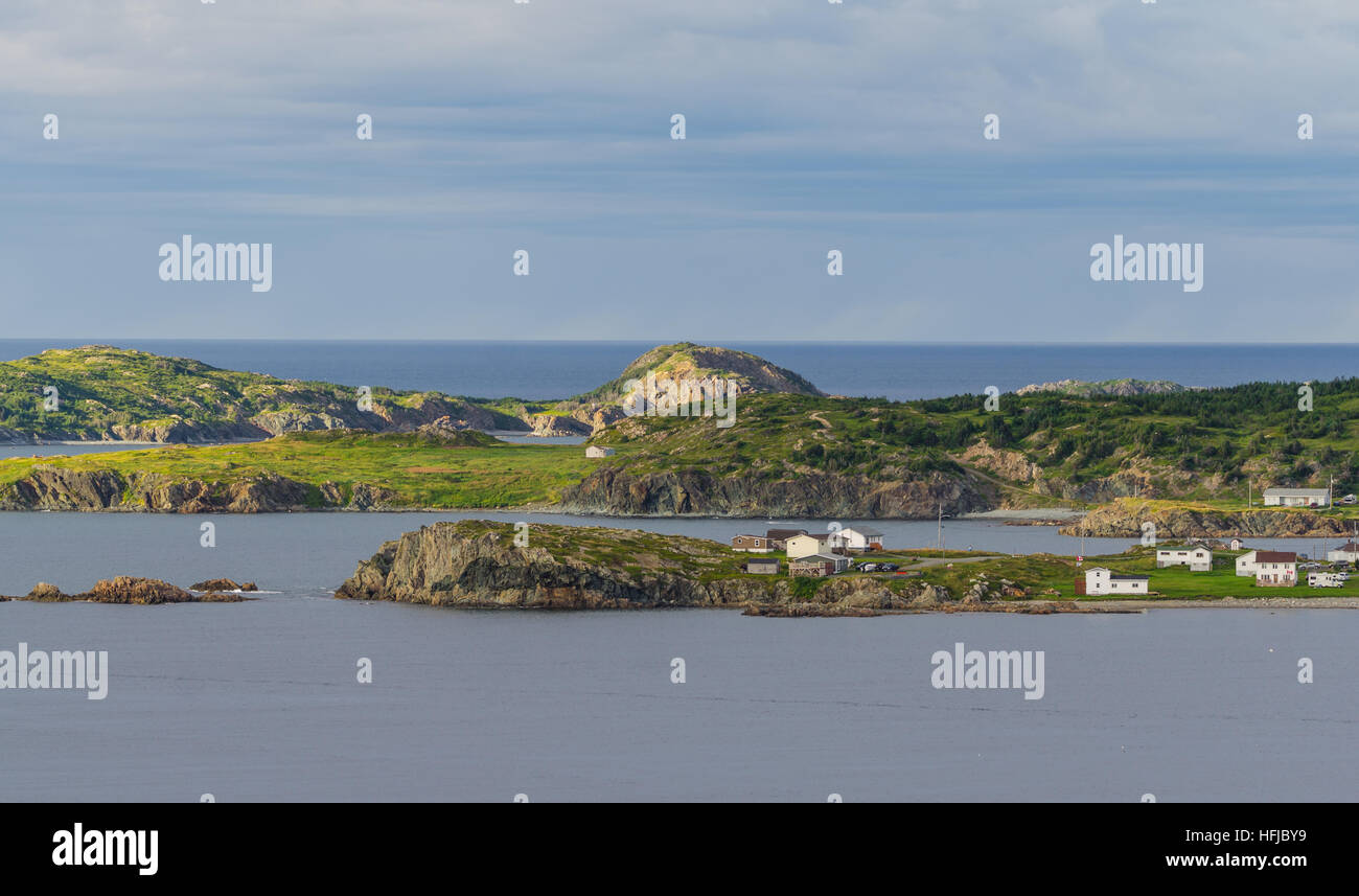 Houses nestled amongst rocky, seaside landscape in Twillingate Newfoundland, Canada. Stock Photo