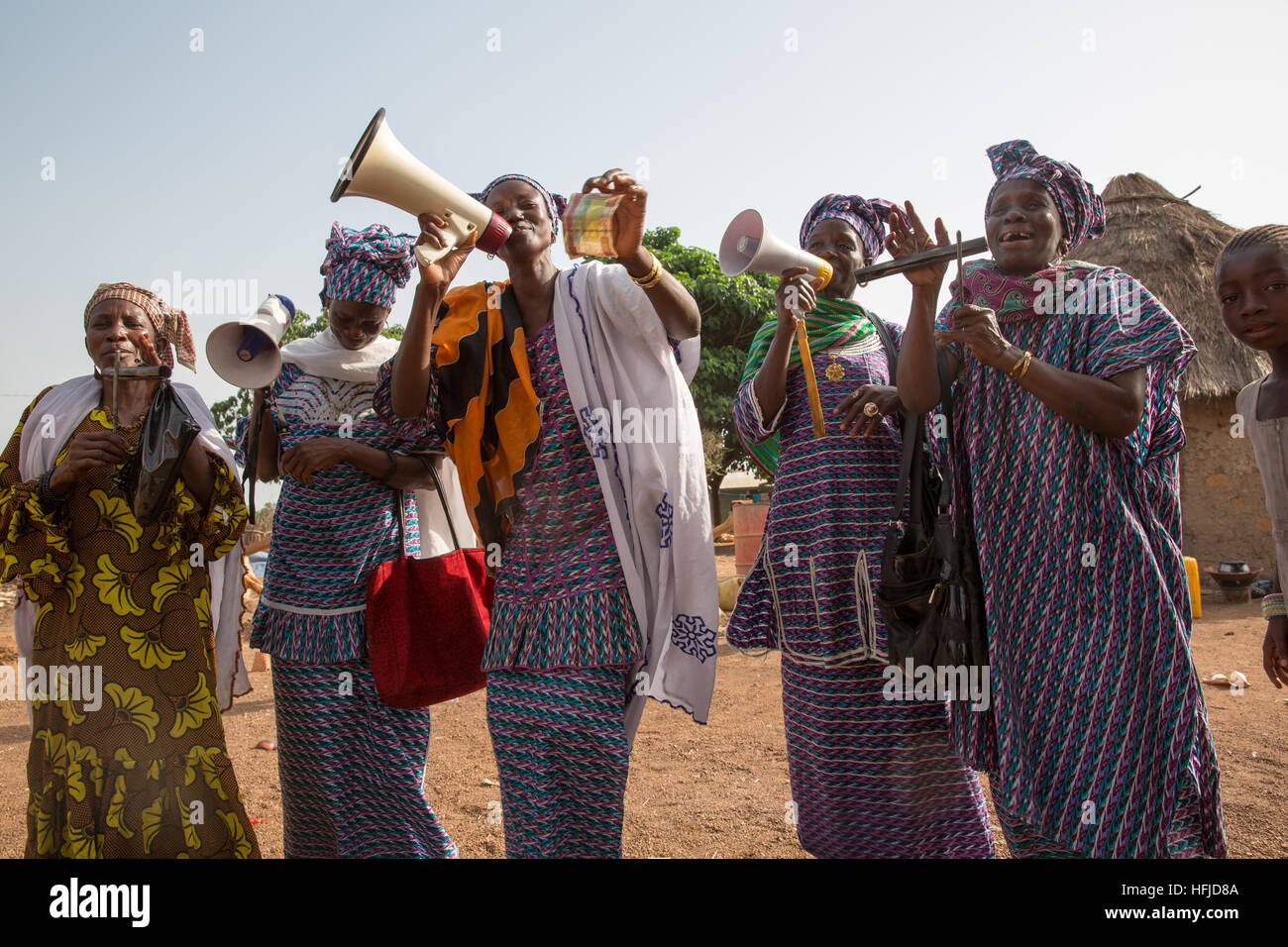Kiniero, Guinea, April 2015:  Bintou Condé and friends singing for little money after a traditional annual lake-fishing party. Stock Photo